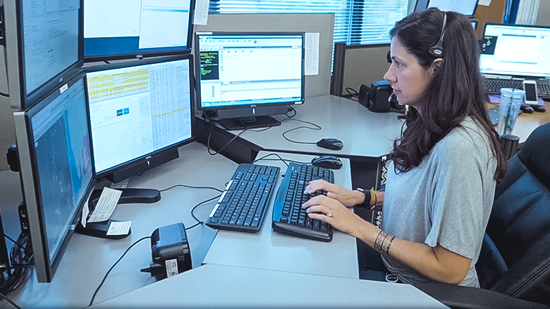 Emergency call center worker at computer